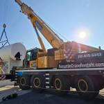 A boom truck working a commercial rooftop lift