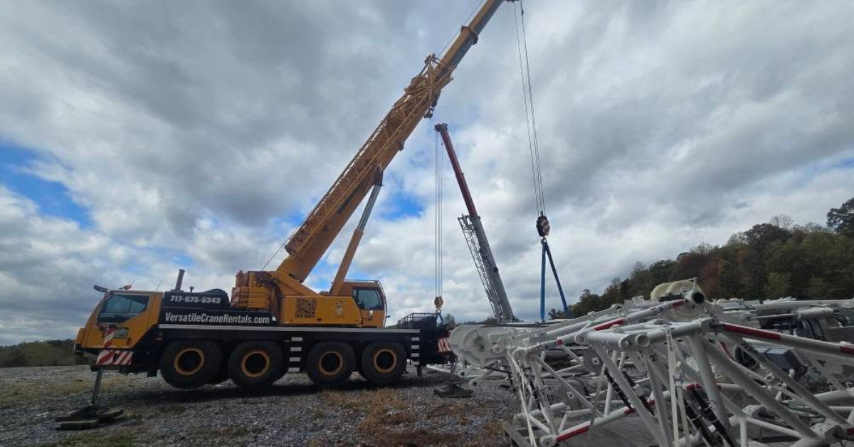 Mobile crane lifting an antenna panel onto a monopole cell tower in Lancaster County, PA