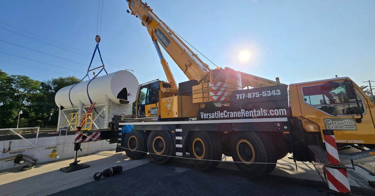 Mobile crane lifting rooftop HVAC unit in Lancaster County, PA with certified operators providing safe commercial equipment installation services today